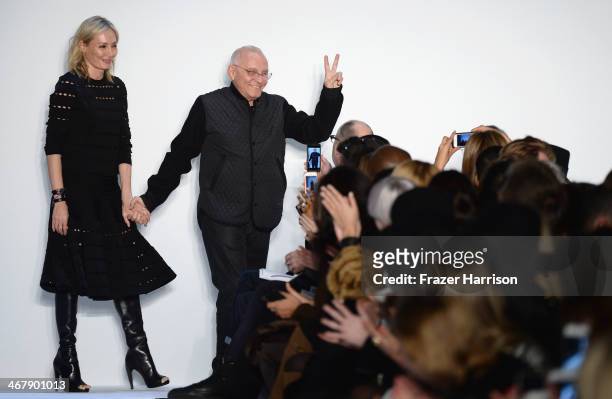 Designers Lubov and Max Azria walk the runway at the Herve Leger By Max Azria fashion show during Mercedes-Benz Fashion Week Fall 2014 at The Theatre...