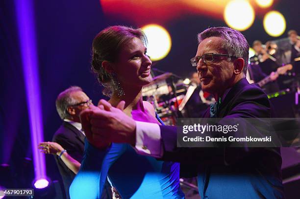 Fencer Britta Heidemann and Minister of State Affairs Thomas de Maiziere dance at the opening of Ball des Sports 2014 at Rhein-Main-Halle on February...