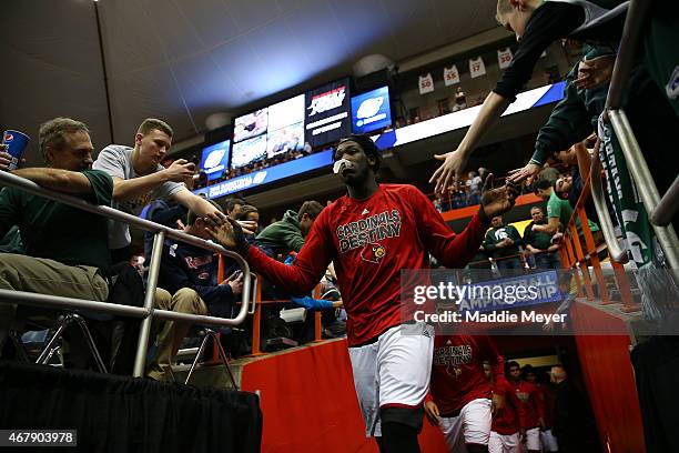 Montrezl Harrell of the Louisville Cardinals high five fans prior to the start of the second half of their game against the North Carolina State...