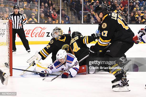 Niklas Svedberg of the Boston Bruins leans back to make a save against Jesper Fast of the New York Rangers at the TD Garden on March 28, 2015 in...