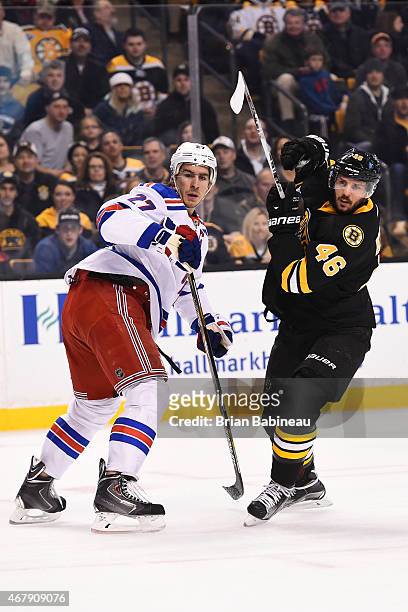 David Krjeci of the Boston Bruins watches the play against Ryan McDonagh of the New York Rangers at the TD Garden on March 28, 2015 in Boston,...