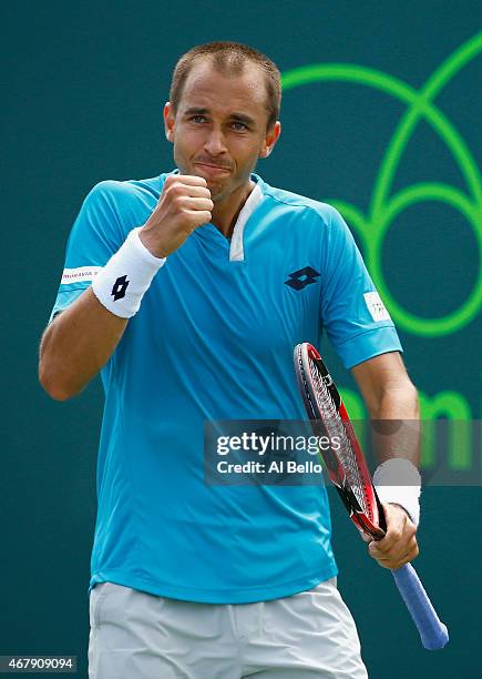 Lukas Rosol of the Czech Republic celebrates a point against Alexander Zverev of Germany during day 6 of the Miami Open at Crandon Park Tennis Center...