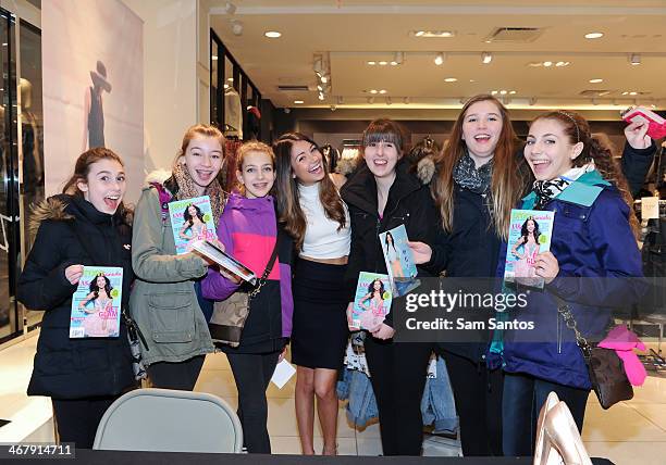 Actress Cristine Prosperi poses with fans at the Forever 21 and PROM Canada magazine autograph signing at the Eaton Centre Shopping Centre on...