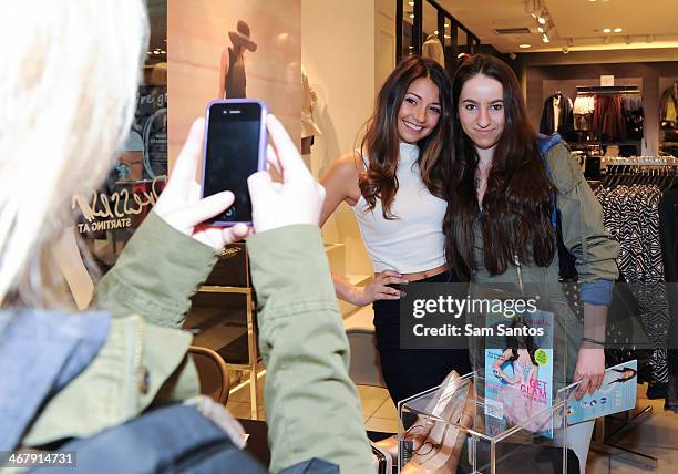 Actress Cristine Prosperi poses with fans at the Forever 21 and PROM Canada magazine autograph signing at the Eaton Centre Shopping Centre on...