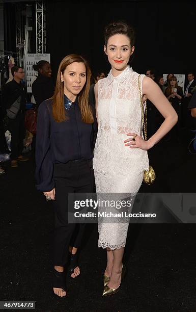 Designer Monique Lhuillier and actress Emmy Rossum backstage at the Monique Lhuillier fashion show during Mercedes-Benz Fashion Week Fall 2014 at The...