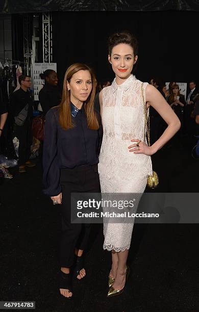 Designer Monique Lhuillier and actress Emmy Rossum backstage at the Monique Lhuillier fashion show during Mercedes-Benz Fashion Week Fall 2014 at The...
