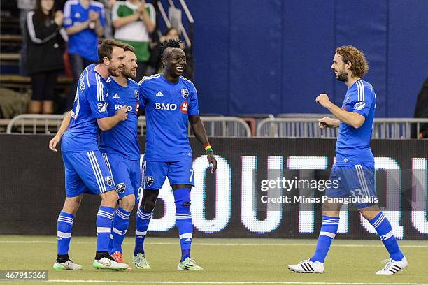 Jack McInerney of Montreal Impact celebrates his goal with teammates during the MLS game against the Orlando City SC at the Olympic Stadium on March...