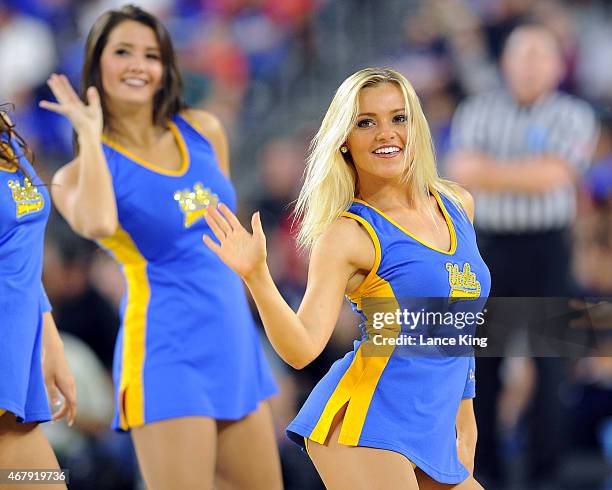 Cheerleaders of the UCLA Bruins perform against the Gonzaga Bulldogs during the South Regional Semifinal round of the 2015 NCAA Men's Basketball...