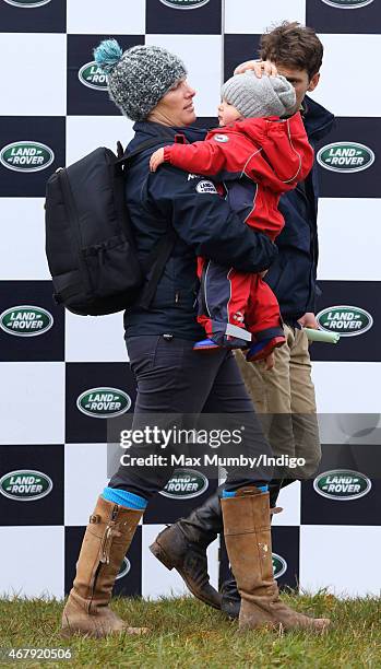 Zara Phillips carries daughter Mia Tindall as she attends the Gatcombe Horse Trials at Gatcombe Park on March 28, 2015 in Stroud, England.