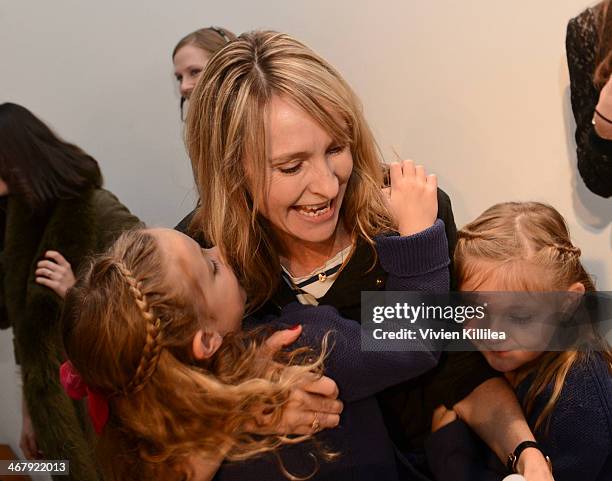 Fashion designer Rebecca Taylor embraces her children backstage after her show at the Rebecca Taylor fashion show during Mercedes-Benz Fashion Week...