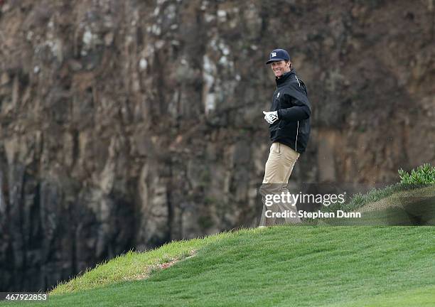 New England Patriots quarterback Tom Brady walks down to his ball near the cliff on the eighth hole during the third round of the AT&T Pebble Beach...