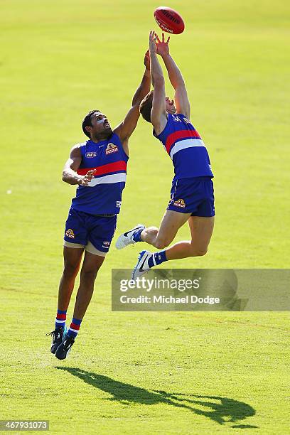 Lachie Hunter marks the ball against Brett Goodes during a Western Bullldogs AFL training session at Victoria University Whitten Oval on February 9,...