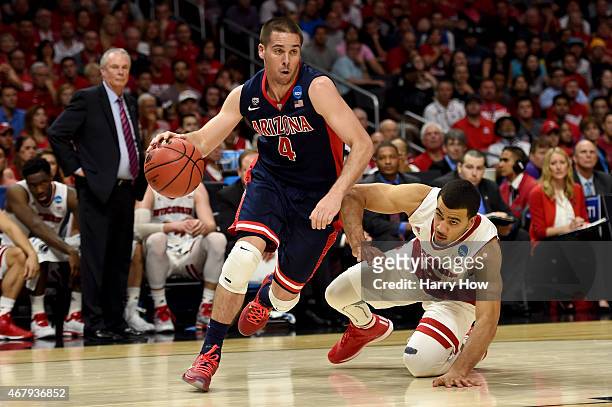 McConnell of the Arizona Wildcats drives past Traevon Jackson of the Wisconsin Badgers in the first half during the West Regional Final of the 2015...