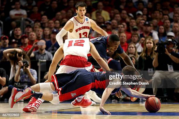 McConnell of the Arizona Wildcats dives for a loose ball against Traevon Jackson of the Wisconsin Badgers in the second half during the West Regional...