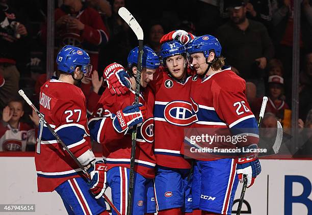 Lars Eller, Jeff Petry, Alex Galchenyuk and Brian Flynn of the Montreal Canadiens celebrate after scoring a goal against the Florida Panthers in the...