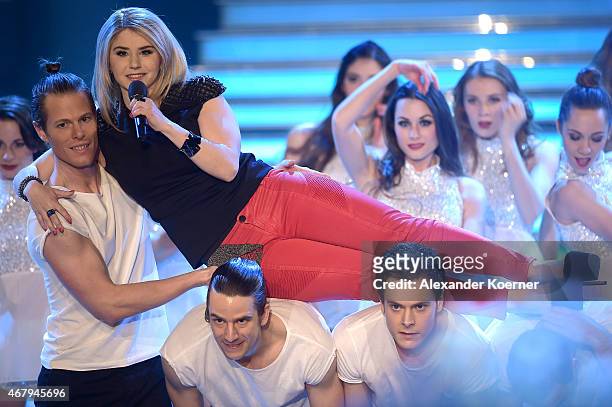 Beatrice Egli performs during the national tv show 'Willkommen bei Carmen Nebel' at TUI Arena on March 28, 2015 in Hanover, Germany.