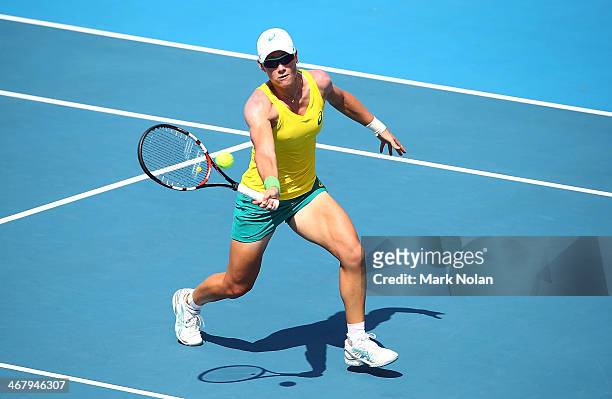 Samantha Stosur of Australia plays a forehand in her singles match against Victoria Kan of Russia during the Fed Cup tie between Australia and Russia...