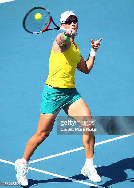 Samantha Stosur of Australia plays a forehand in her singles match against Victoria Kan of Russia during the Fed Cup tie between Australia and Russia...