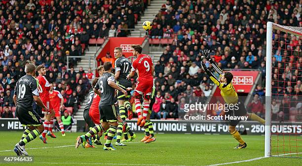 Asmir Begovic of Stoke watches Ricky Lambert's free kick fly past him to make it 1-0 during the Barclays Premier League match between Southampton and...