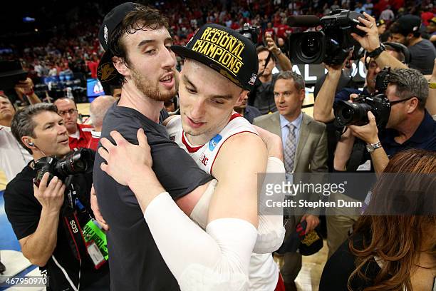 Frank Kaminsky and Sam Dekker of the Wisconsin Badgers celebrate the Badgers 85-78 win against the Arizona Wildcats during the West Regional Final of...