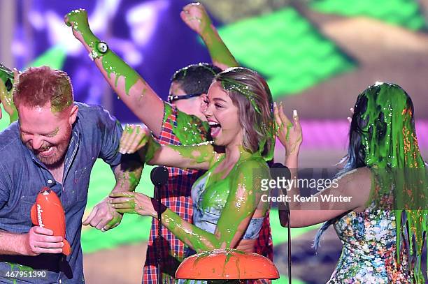 Actors Jesse Tyler Ferguson, Rico Rodriguez, Sarah Hyland and Ariel Winter get slimed as they accept award for Favorite Family TV Show for Modern...