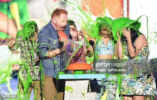 Actors Nolan Gould, Jesse Tyler Ferguson, Rico Rodriguez, Sarah Hyland and Ariel Winter get slimed onstage during Nickelodeon's 28th Annual Kids'...