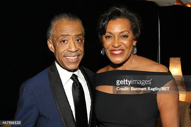Reverend Al Sharpton and visual artist Carrie Mae Weems pose backstage at BET Honors 2014 at Warner Theatre on February 8, 2014 in Washington, DC.