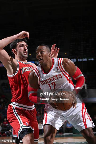 Dwight Howard of the Houston Rockets goes to the basket against Zaza Pachulia of the Milwaukee Bucks on February 8, 2014 at the BMO Harris Bradley...