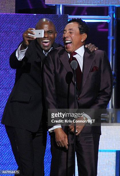 Actor Wayne Brady and musician Smokey Robinson pose onstage at BET Honors 2014 at Warner Theatre on February 8, 2014 in Washington, DC.