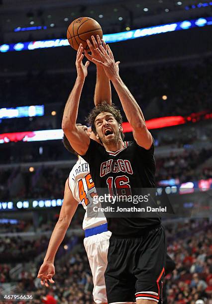 Pau Gasol of the Chicago Bulls is hit in the head by Cole Aldrich of the New York Knicks as he rebounds at the United Center on March 28, 2015 in...