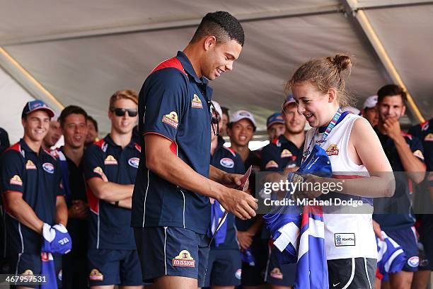 Jason Johannisen receives his jumper from a fan during a Western Bulldogs AFL training and Family Day session at Victoria University Whitten Oval on...