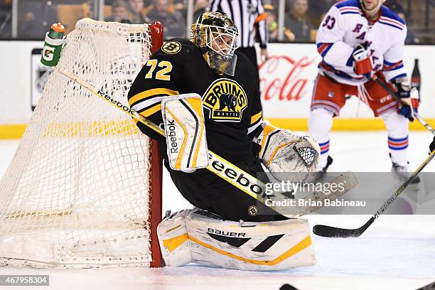 Niklas Svedberg of the Boston Bruins makes a save against the New York Rangers at the TD Garden on March 28, 2015 in Boston, Massachusetts.