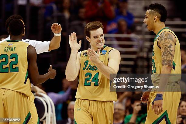 Pat Connaughton of the Notre Dame Fighting Irish reacts with teammates after a play in the second half against the Kentucky Wildcats during the...