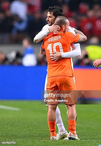 Turkey's Hakan Balta hugs with The Netherlands' Sneijder during the Euro 2016 qualifying round football match Netherlands and Turkey at the Arena...