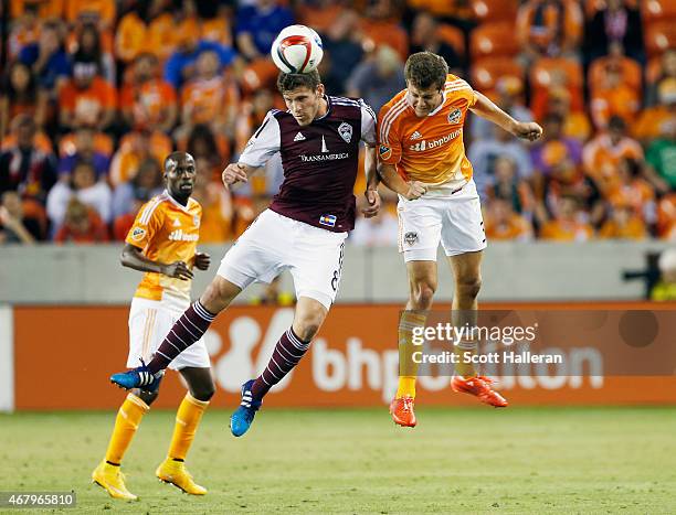 Dillon Powers of the Colorado Rapids battles for the ball with Rob Lovejoy of the Houston Dynamo during their game at BBVA Compass Stadium on March...