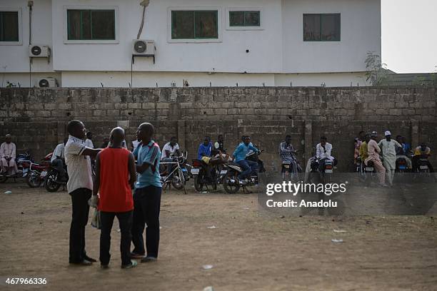 Line of Nigerian voters waiting to cast their ballots at Daawa polling station in Nasarawa region of Kano, Nigeria on 28 March 2015. Millions of...