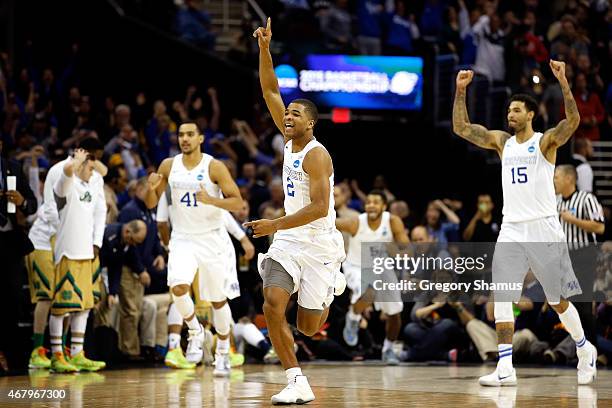 Aaron Harrison of the Kentucky Wildcats celebrates after defeating the Notre Dame Fighting Irish during the Midwest Regional Final of the 2015 NCAA...