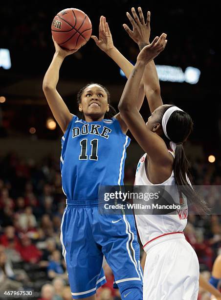 Azura Stevens of the Duke Blue Devils puts up a shot against Laurin Mincy of the Maryland Terrapins during the third round of the 2015 NCAA Division...