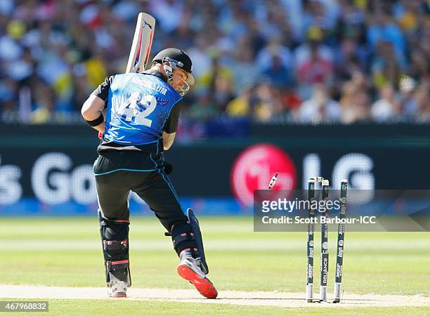 Brendon McCullum of New Zealand looks at his stumps as he is out bowled by Mitchell Starc of Australia during the 2015 ICC Cricket World Cup final...