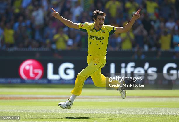 Mitchell Starc of Australia celebrates taking the wicket of Brendon McCullum of New Zealand during the 2015 ICC Cricket World Cup final match between...
