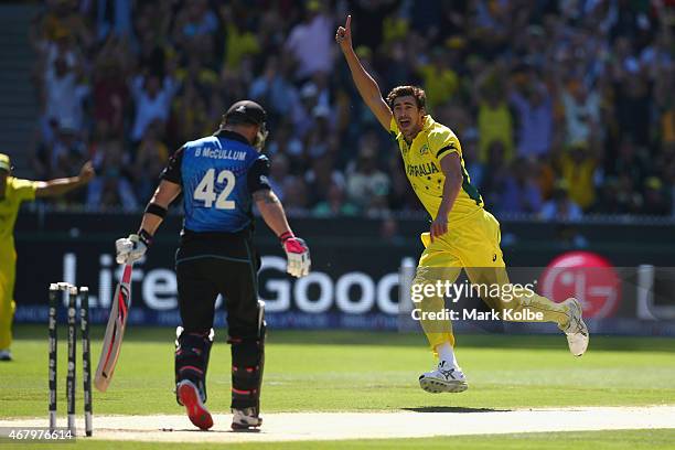 Mitchell Starc of Australia celebrates taking the wicket of Brendon McCullum of New Zealand during the 2015 ICC Cricket World Cup final match between...