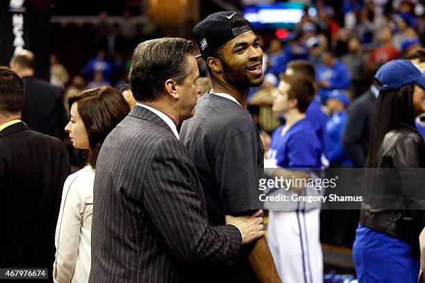 Head coach John Calipari of the Kentucky Wildcats celebrates with Andrew Harrison after defeating the Notre Dame Fighting Irish during the Midwest...