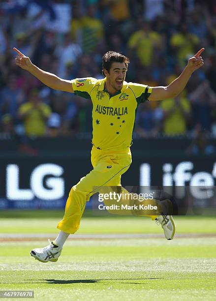 Mitchell Starc of Australia celebrates taking the wicket of Brendon McCullum of New Zealand during the 2015 ICC Cricket World Cup final match between...