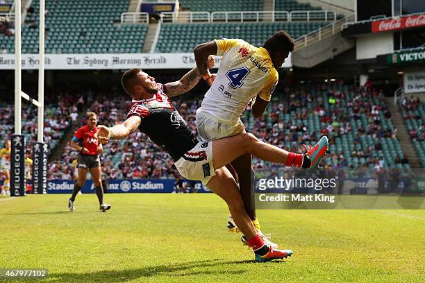 Shaun Kenny-Dowall of the Roosters challenges Edrick Lee of the Raiders for a high ball during the round four NRL match between the Sydney Roosters...