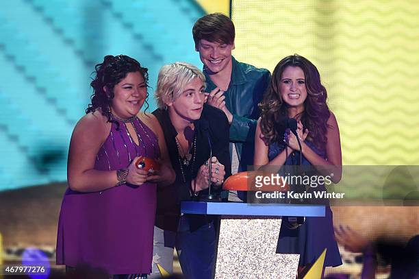 Actors Raini Rodriguez, Ross Lynch, Calum Worthy and Laura Marano accept award for Favorite Kids TV Show for 'Austin & Ally' onstage during...
