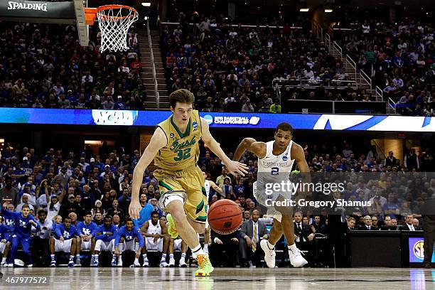 Steve Vasturia of the Notre Dame Fighting Irish goes for a loose ball against Aaron Harrison of the Kentucky Wildcats in the second half during the...