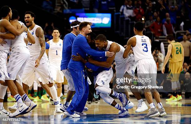 The Kentucky Wildcats celebrate after defeating the Notre Dame Fighting Irish during the Midwest Regional Final of the 2015 NCAA Men's Basketball...