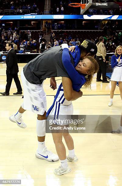 Marcus Lee of the Kentucky Wildcats hugs a cheerleader after defeating the Notre Dame Fighting Irish during the Midwest Regional Final of the 2015...