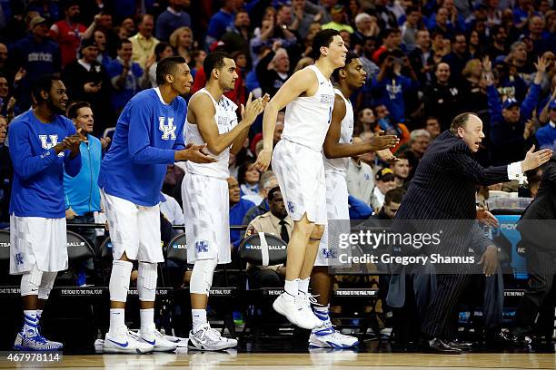 The Kentucky Wildcats bench celebrates late in the game against the Notre Dame Fighting Irish during the Midwest Regional Final of the 2015 NCAA...