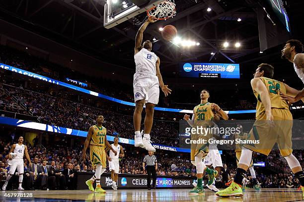 Aaron Harrison of the Kentucky Wildcats dunks the ball in the second half against the Notre Dame Fighting Irish during the Midwest Regional Final of...